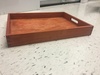 Red stained wooden tray