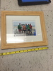 Light wood frame with family portrait