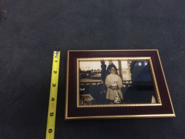 Dark wood and gold framed photo