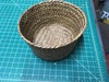 Round wicker basket with solid sides