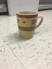 Orange and green ceramic mug