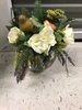 White bouquet with pear in glass vase