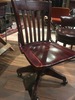 102.4 - Antique Cherry Wood Rolling Bankers Chair 