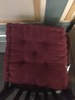 Red tufted cushion